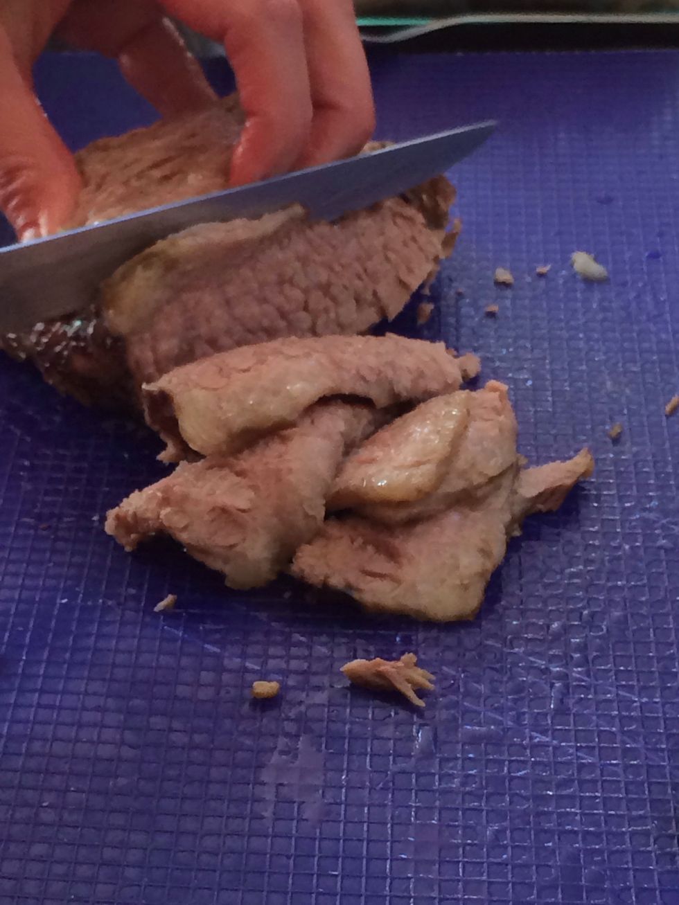 Remove extra fat and thin slice the brisket