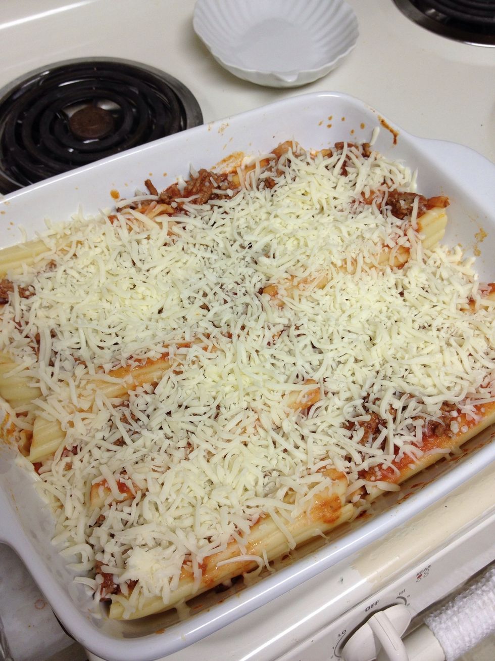 Remove foil and sprinkle 2 cups of shredded mozzarella cheese on top. Leave uncovered and bake for about 5 more minutes.