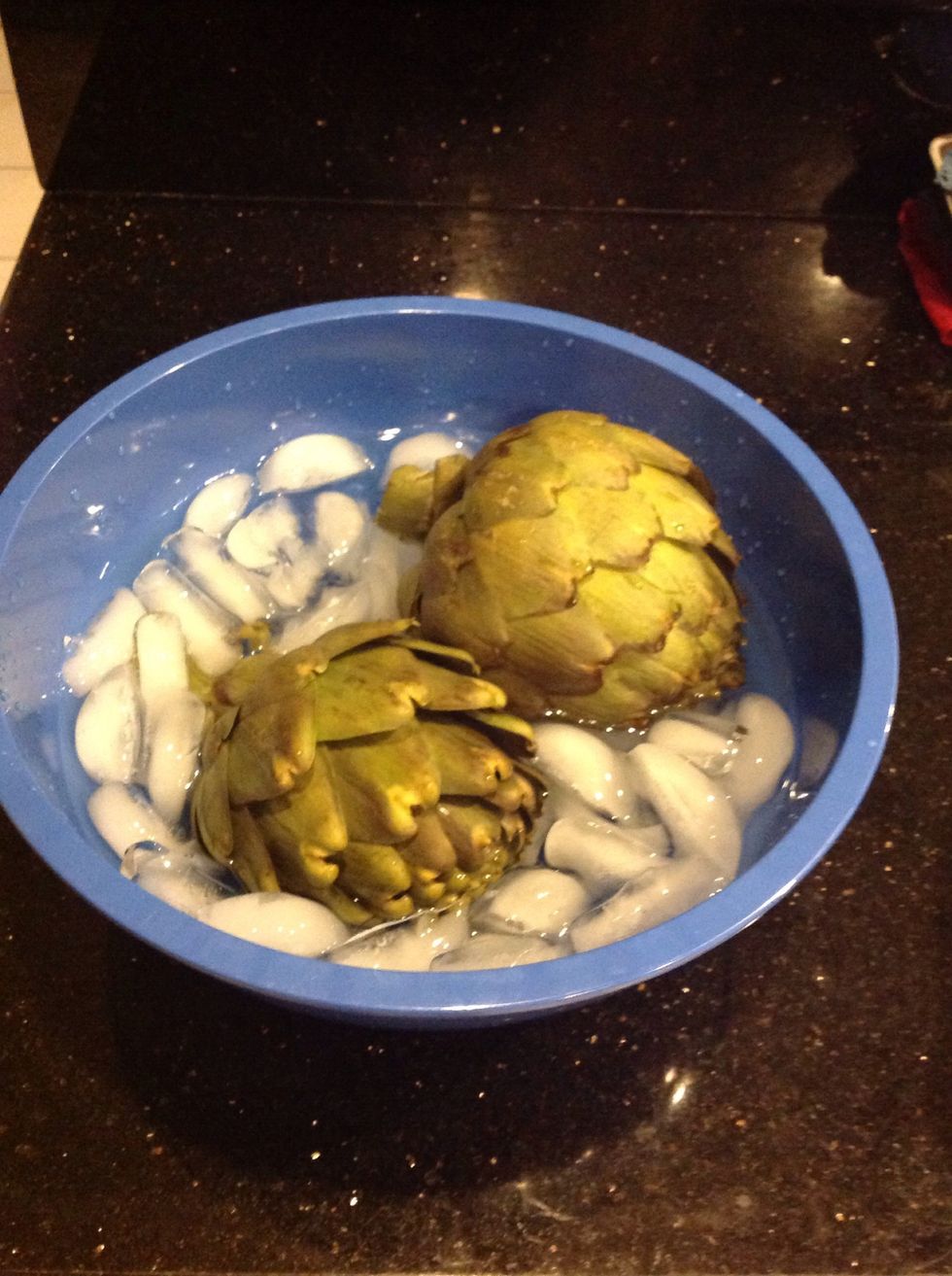 Remove from boiling water and shock in an ice bath for a few seconds.