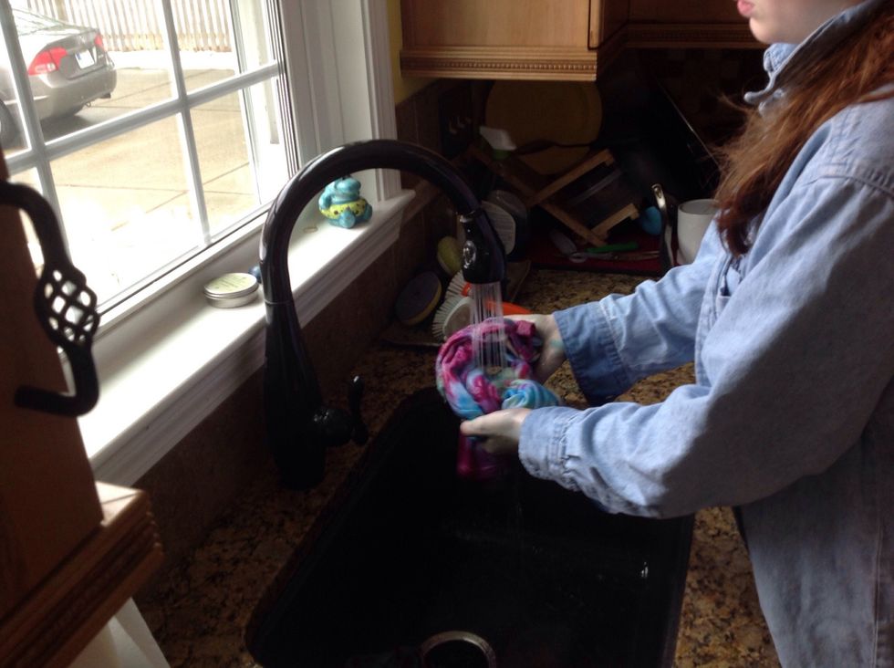 Remove from bucket and rinse in warm water until the water runs clear.