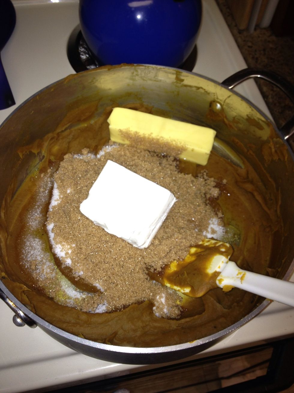 Remove from heat and add 4 oz cream cheese, a stick of butter, and 1 cup of each brown sugar and white sugar. Mix thoroughly