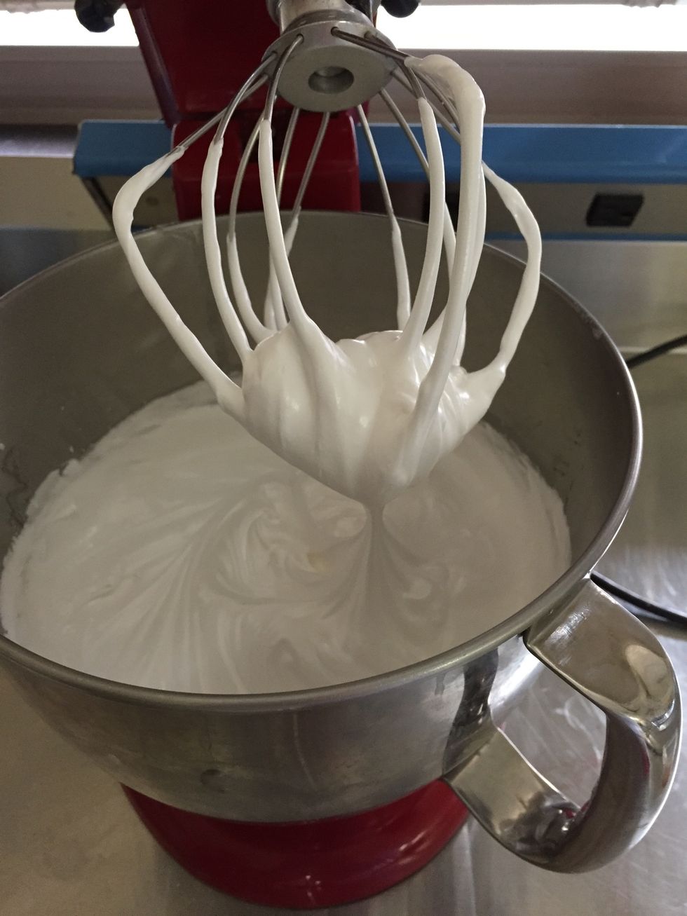 Remove from heat and beat the mixture oh high speed until stiff peaks form, adding the cream of tartar when the mixture begins to thicken, after about 3 minutes.