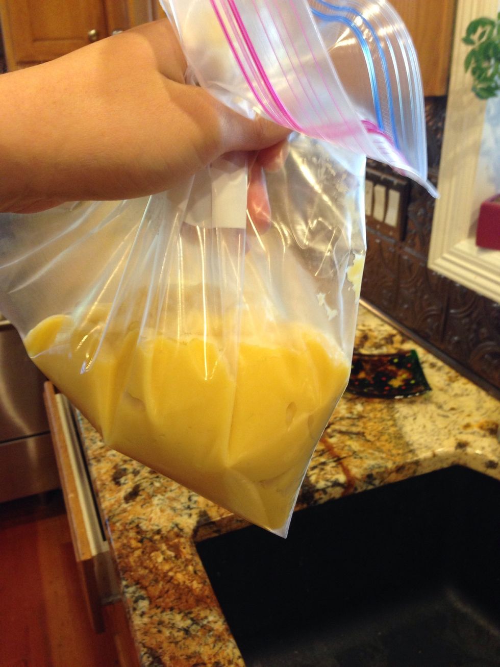 Remove from heat, and stir I'm flour, and salt. Quickly mix in the eggs, stirring constantly, so that the eggs do not cook from the heat. Then place in a piping bag, or plastic baggy.