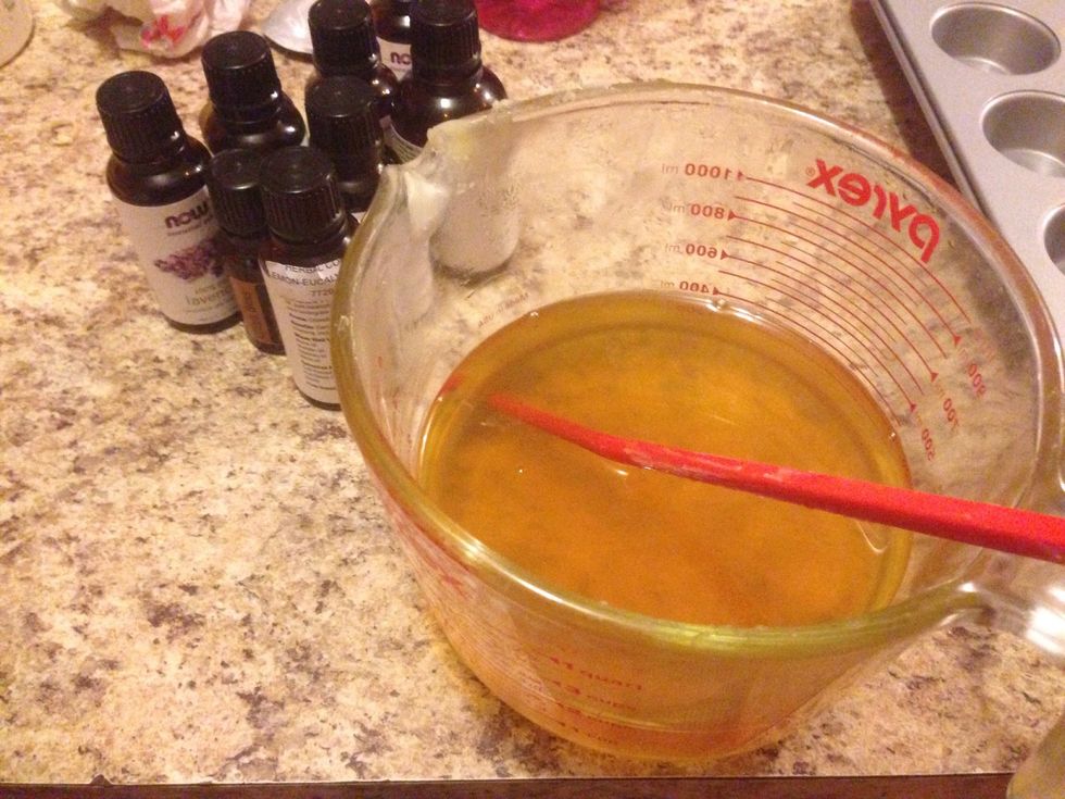 Remove from heat and stir in oils.
