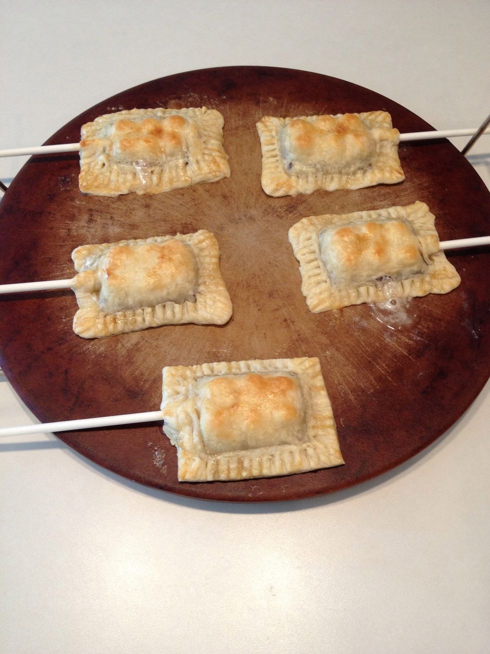 Remove from oven and allow to cool about 5-10 minutes.  Push the stick gently into the chocolate so it will become more stable as the chocolate hardens.