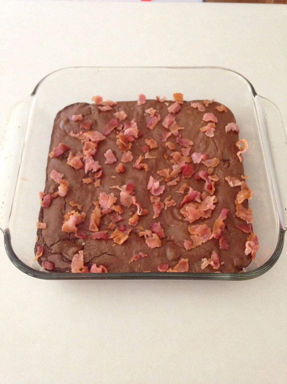 Remove from oven and allow to cool. Spread bacon across top.