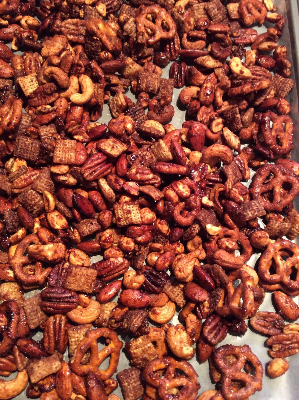 Remove from oven and dump onto wax paper lined jelly roll pan. Cool, break apart. Store in air tight container. Will keep for a month.