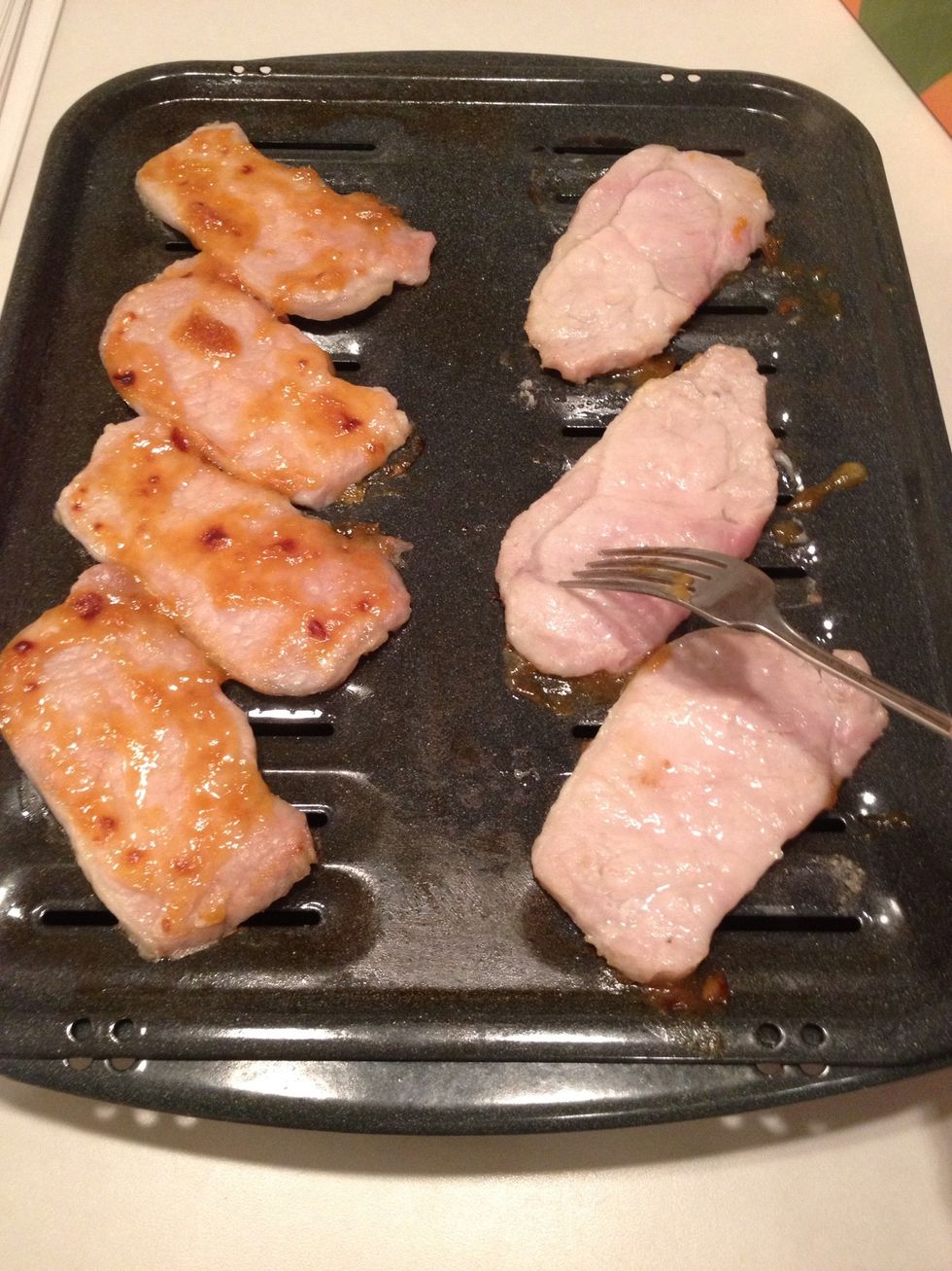 Remove from oven and flip pork chops.