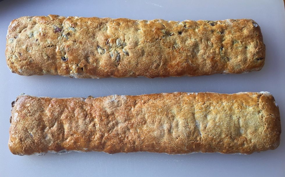 Remove from oven and let biscotti cool for 10 minutes. Reduce oven temperature to 300\u00b0F.