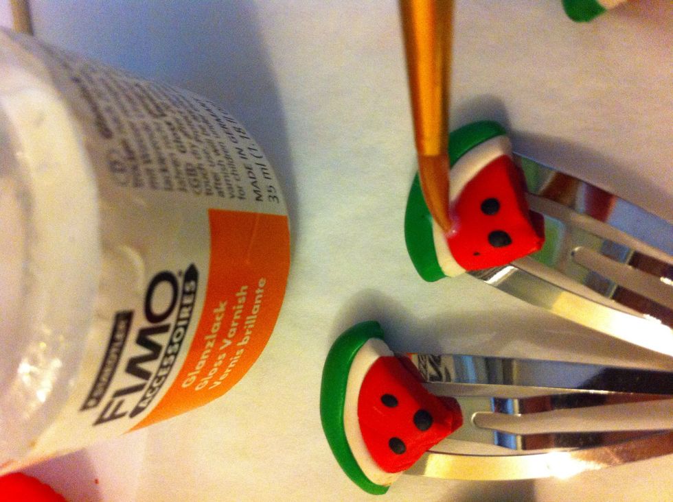 Remove from oven and let cool for a few minutes. Then use a brush to add a layer of gloss varnish.