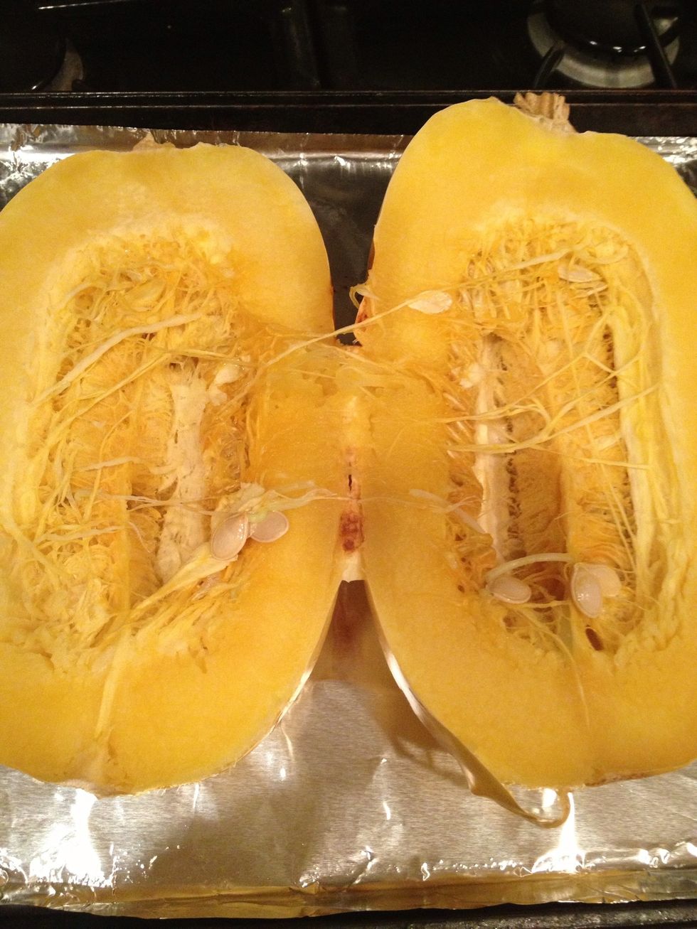 Remove from oven. Slice squash length wise. Use caution squash is hot!!!!