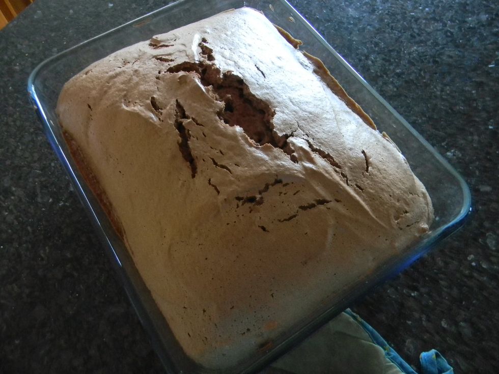 Remove from oven when a toothpick stuck in the middle comes out clean and let it cool for 15 minutes. Guard the cake from pilfering fingers during this time. I failed miserably :D