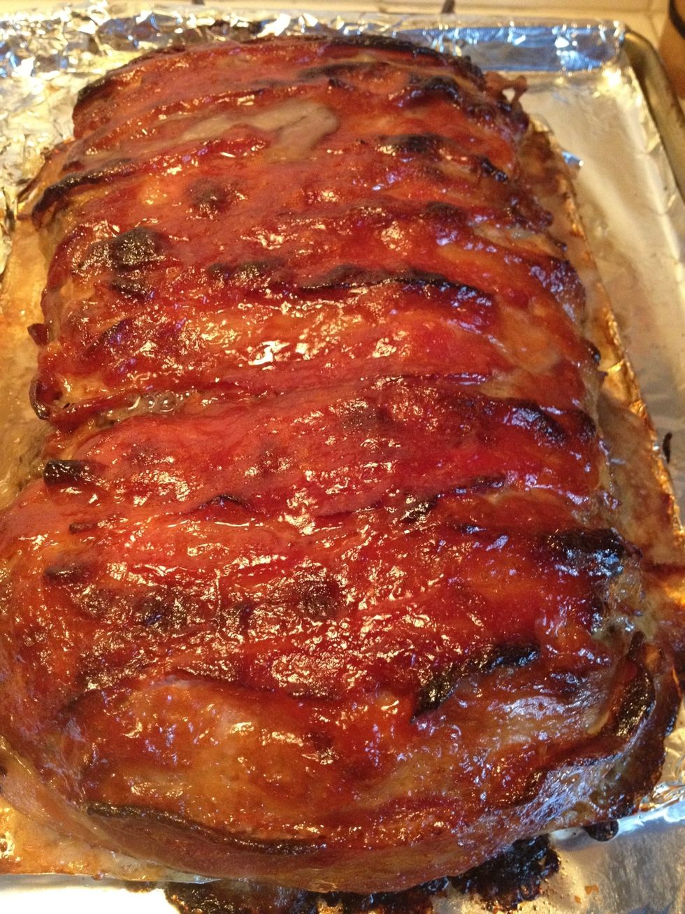 Remove from the oven and let sit about 10 minutes. Slice and serve with some of the remaining sauce.