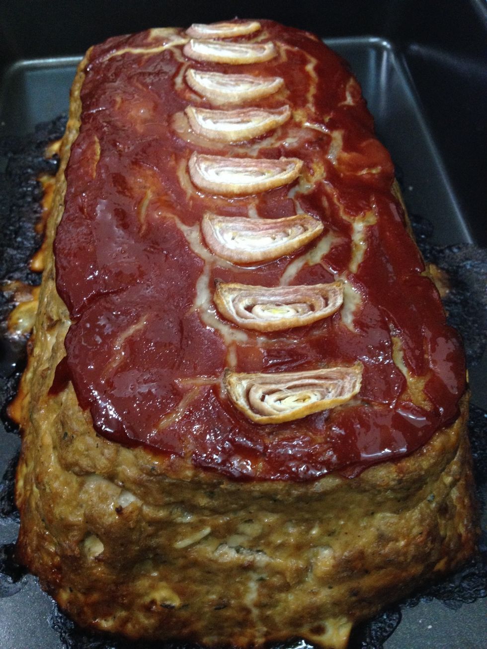 Remove from the oven when the internal temperature reaches 160 degrees Fahrenheit.   Let the meatloaf rest for 10-15 minutes to allow the juices to redistribute  before slicing.