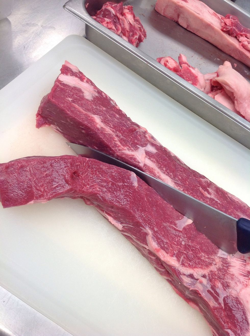 Remove front 1/3 of the loin and reserve for steaks