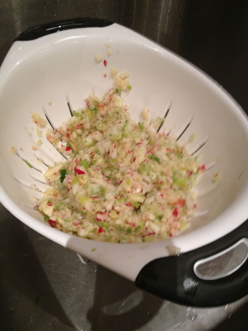 Remove fruit and vegetables and place in colander to drain off the excess liquid.