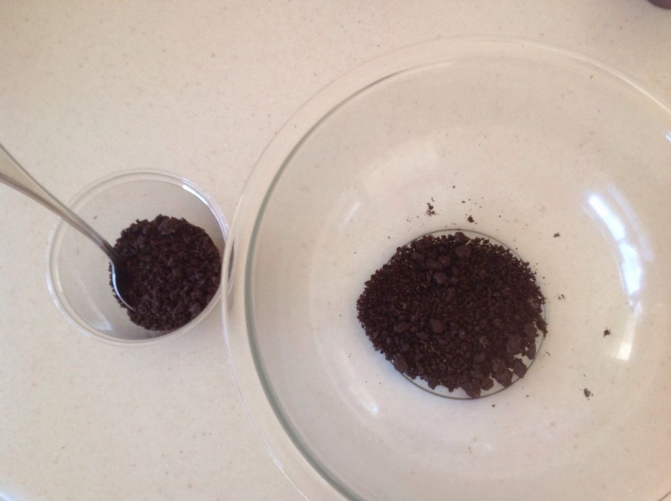 Remove half of the cookie crumbs and put them on the side in another smaller cup or bowl.