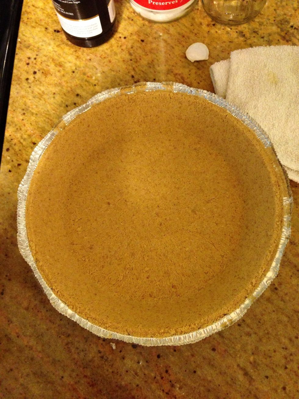 Remove lid from graham cracker crust.