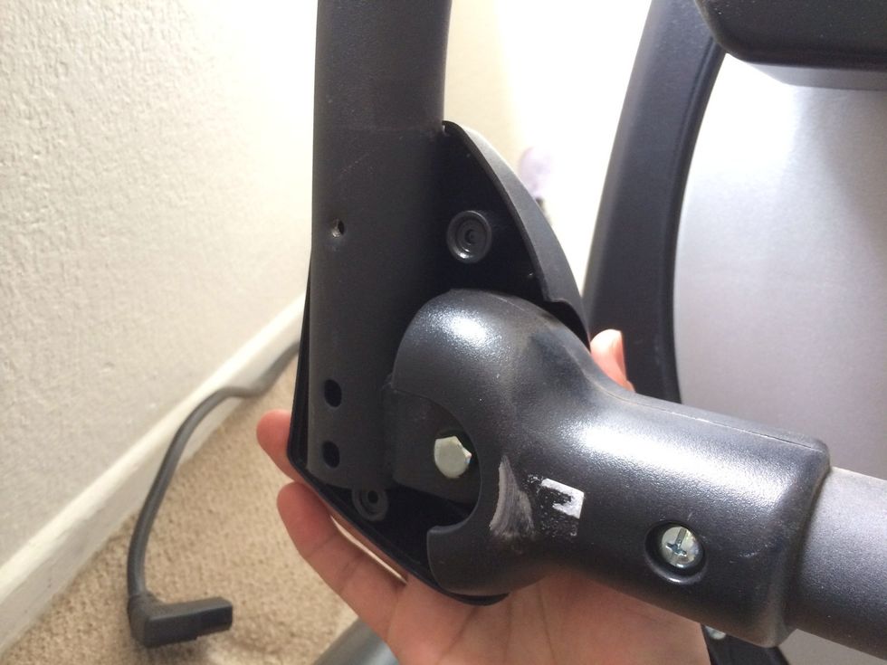 Remove lower enclosure. One bolt on the outside; one large and two small screws on the inside. One enclosure on each side.