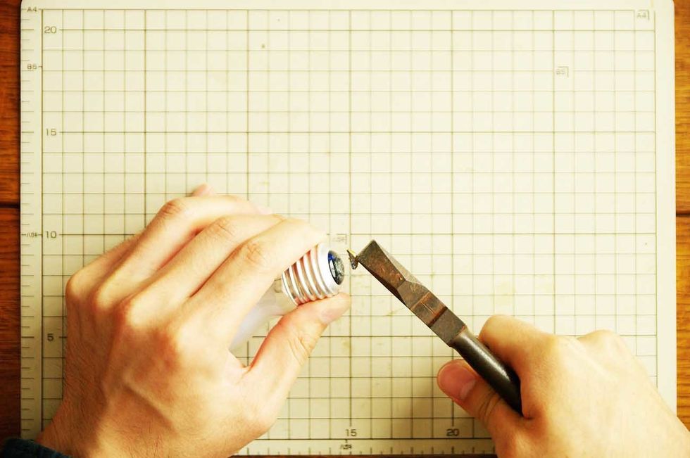 Remove metal parts of the tip with the use of pliers.