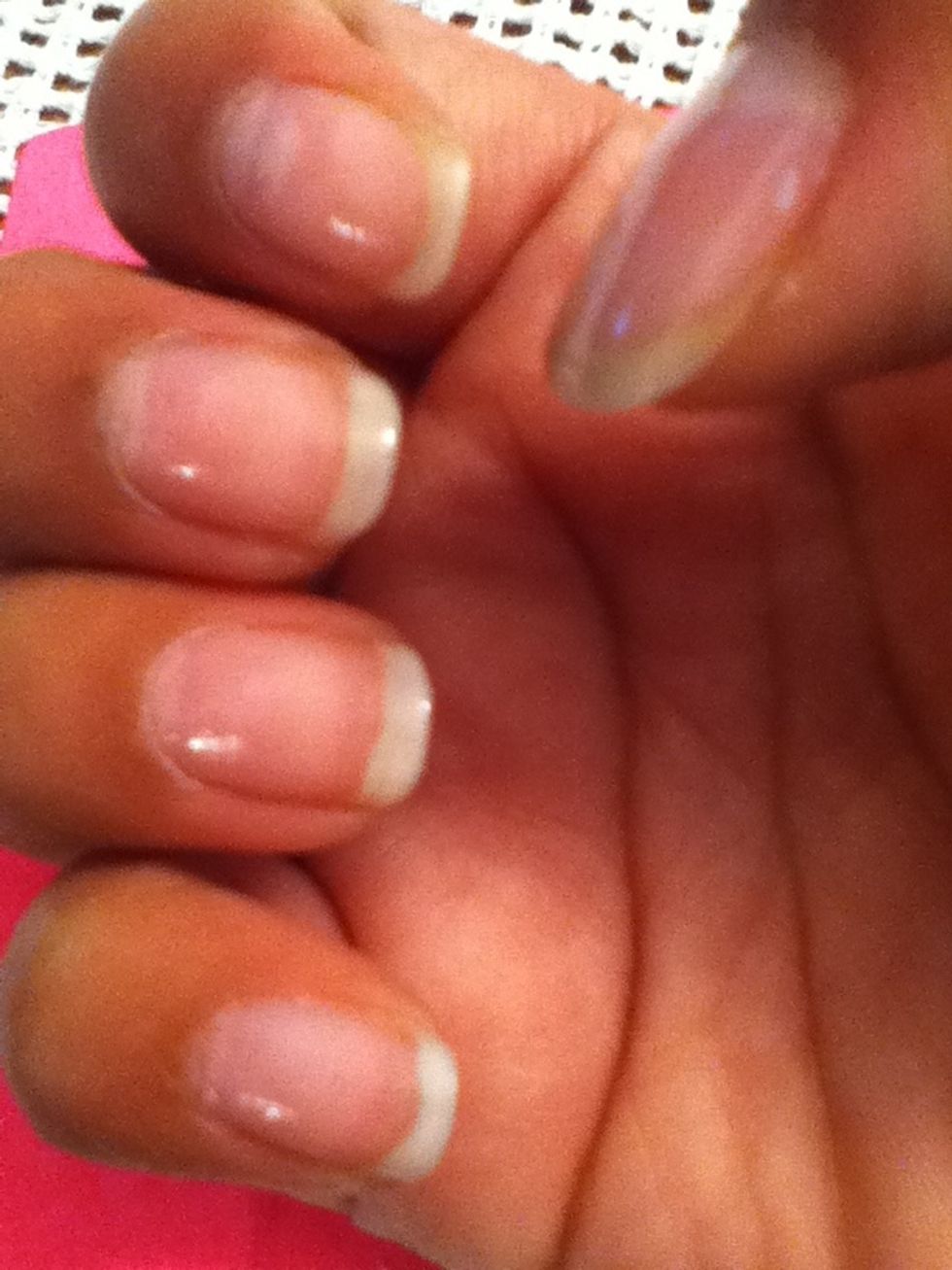 Remove nail polish from your previous manicure and apply a coat of MEGA GROW nail polish