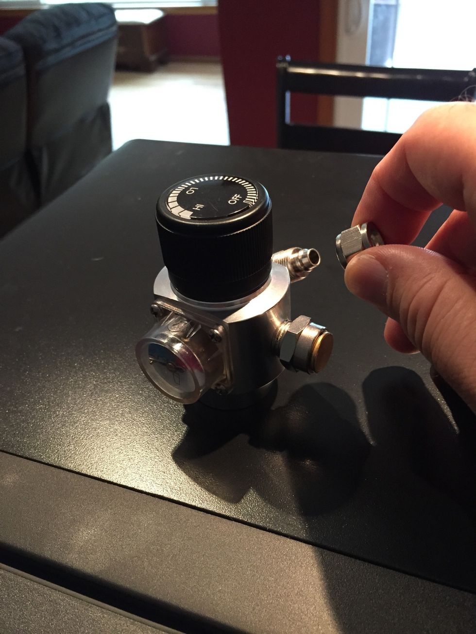 Remove nut from regulator.