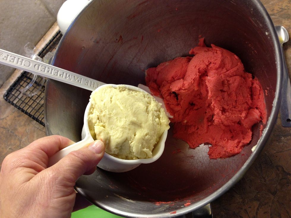 Remove one cup of dough and color remaining dough red.