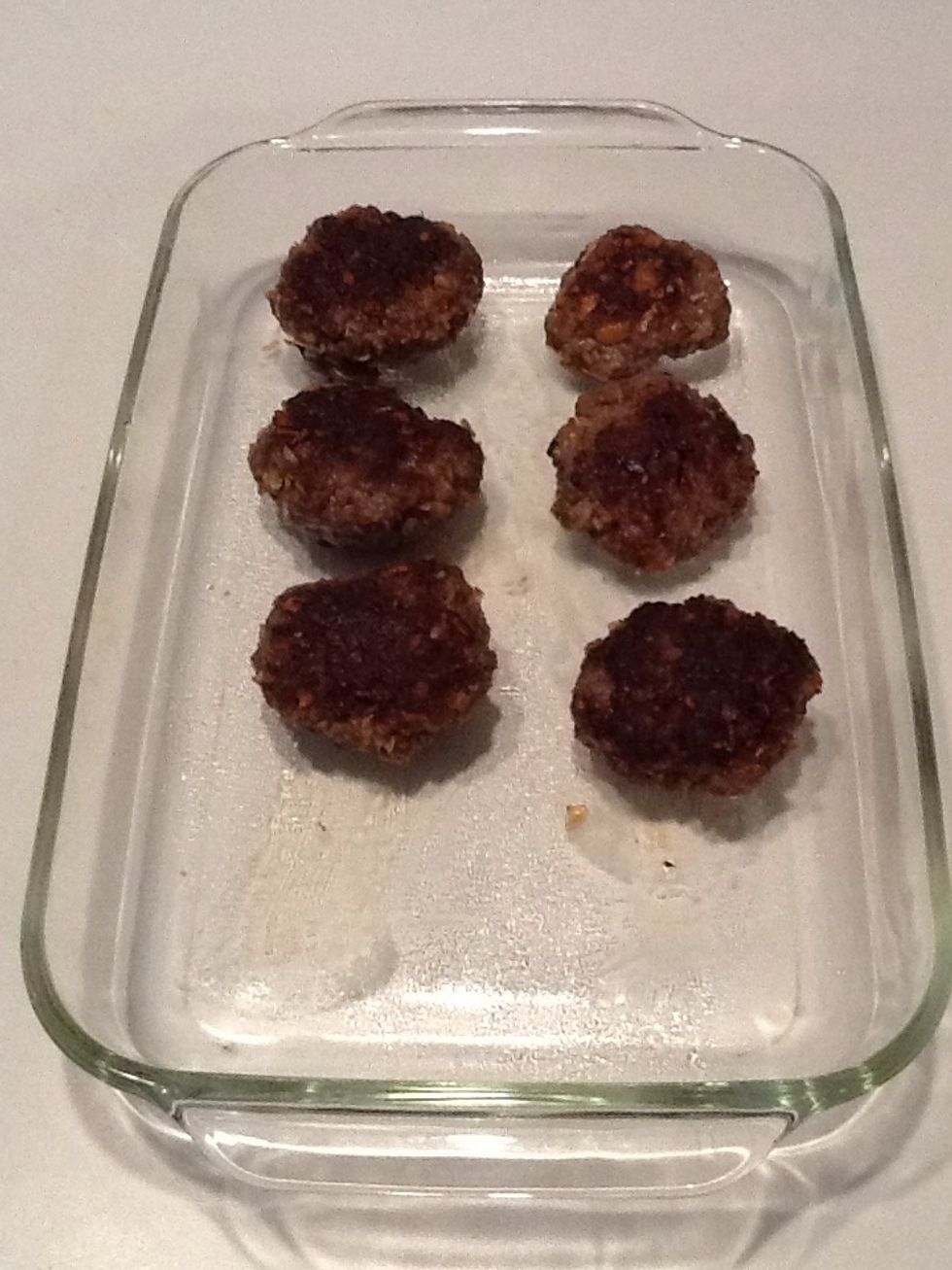 Remove patties from pan and place in greased baking dish.