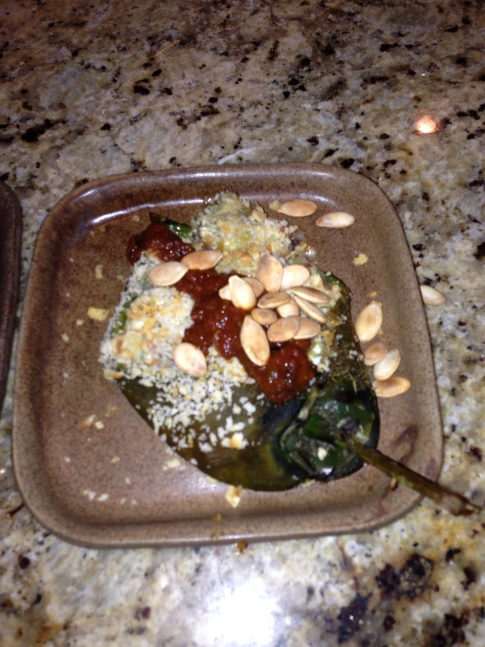 Remove peppers from oven plate up and top with the sauce and toasted pumpkin seeds. ENJOY!