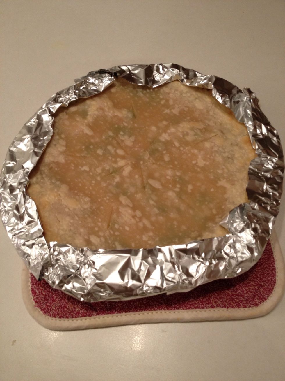 Remove pie and cover edges with aluminum foil to prevent burning. Return pie to the oven and bake for 20-30 minutes or until crust starts to turn golden brown.