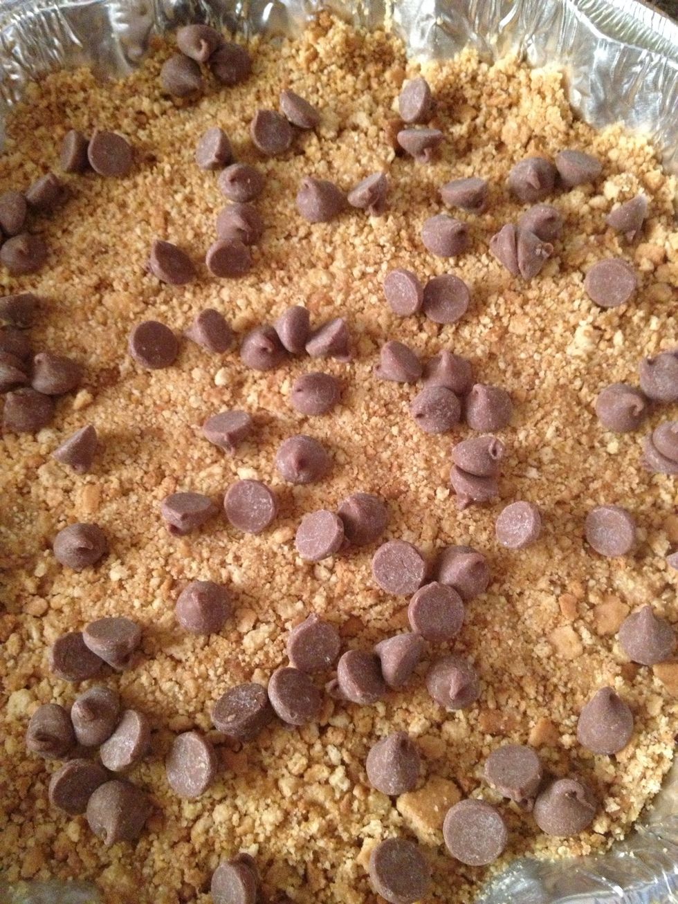 Remove pie crust from fridge then Layer with chocolate chip You can start with anything you want and how much you want