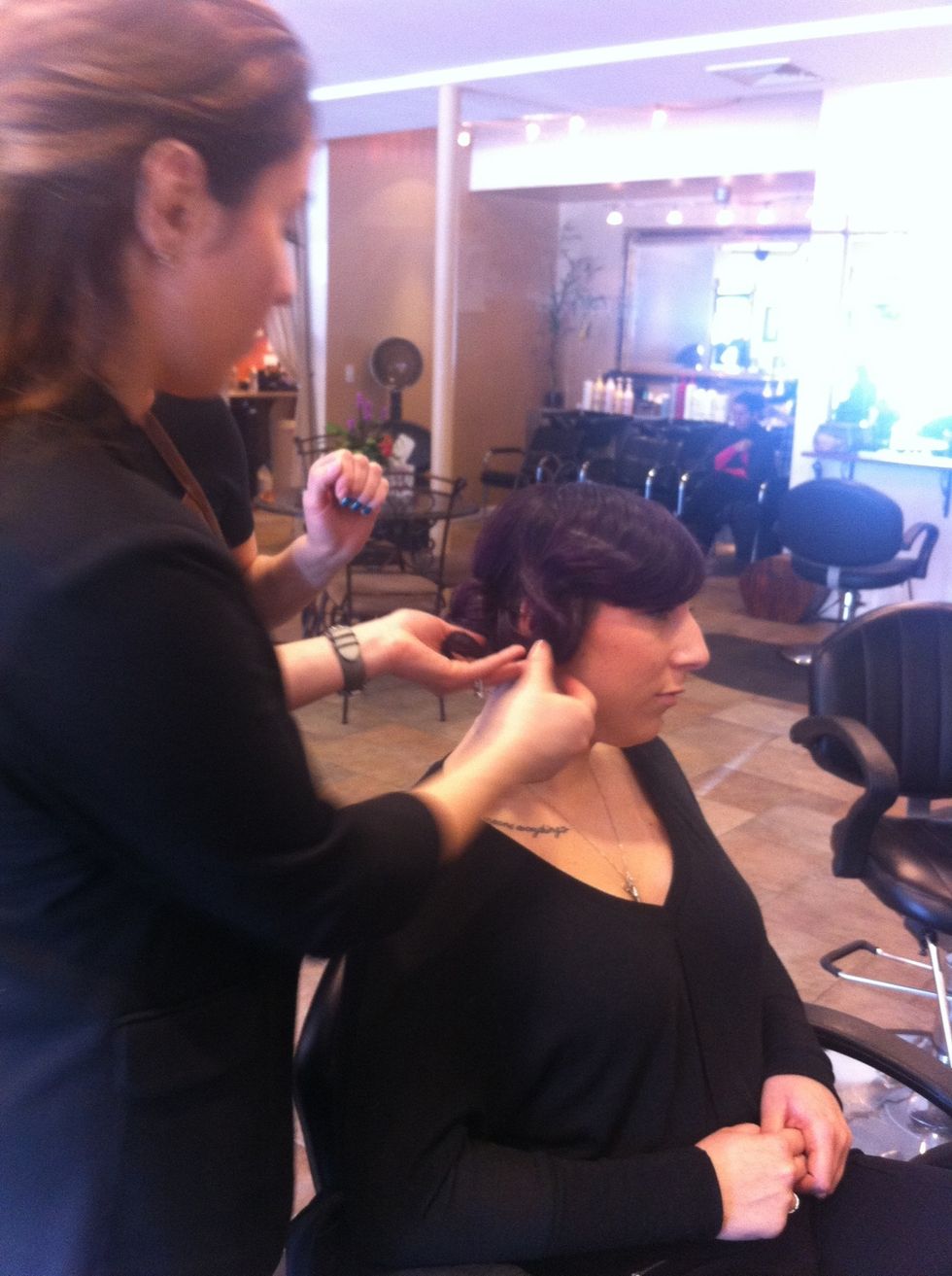 Remove pin curl clips and with disturbing the wave as a little as possible, set hair back into the bun. Secure with bobby pins