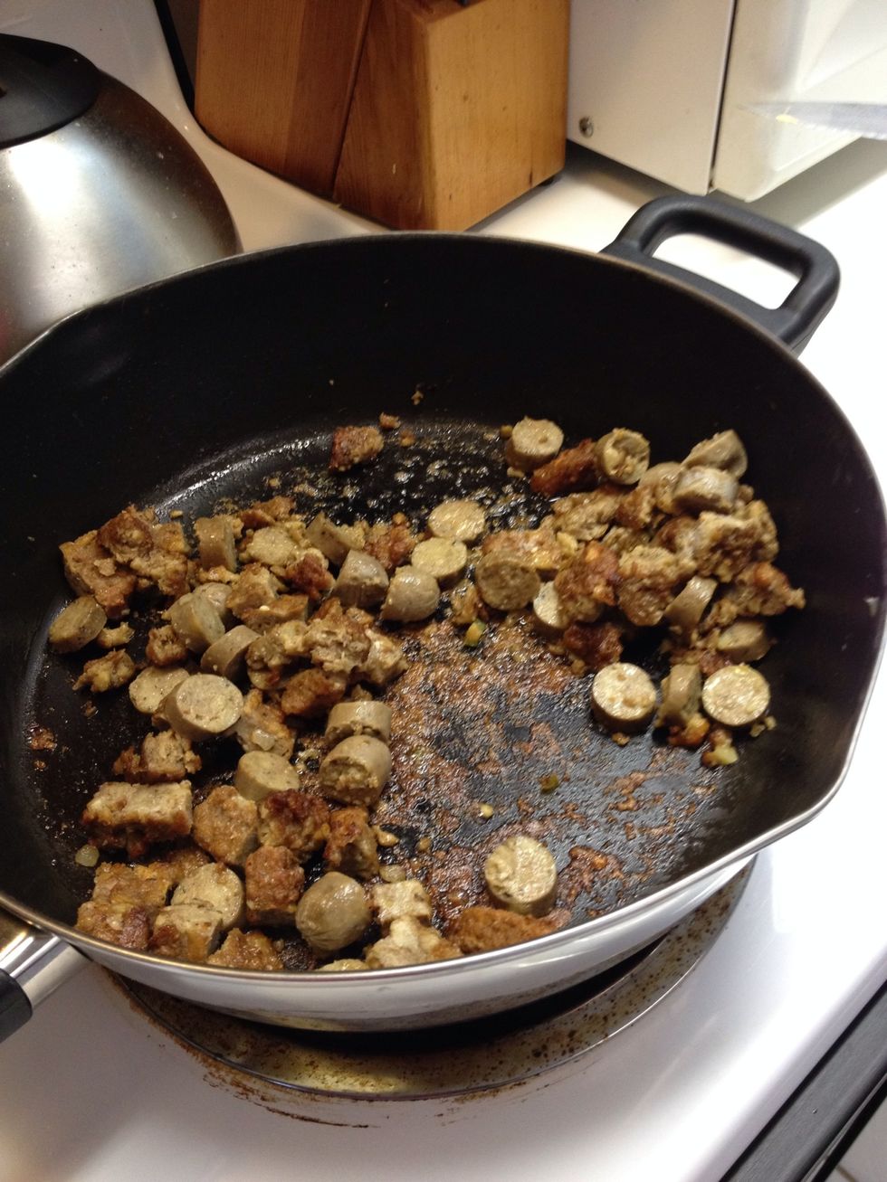 Remove potatoes and add more butter and saut\u00e9 sausage. If already precooked, just heat through. If raw, cook following directions on package. (For vegetarians: I used precooked meatless sausage)