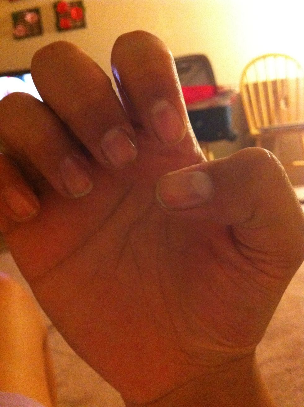 Remove previous nail polish and cover with a base coat.