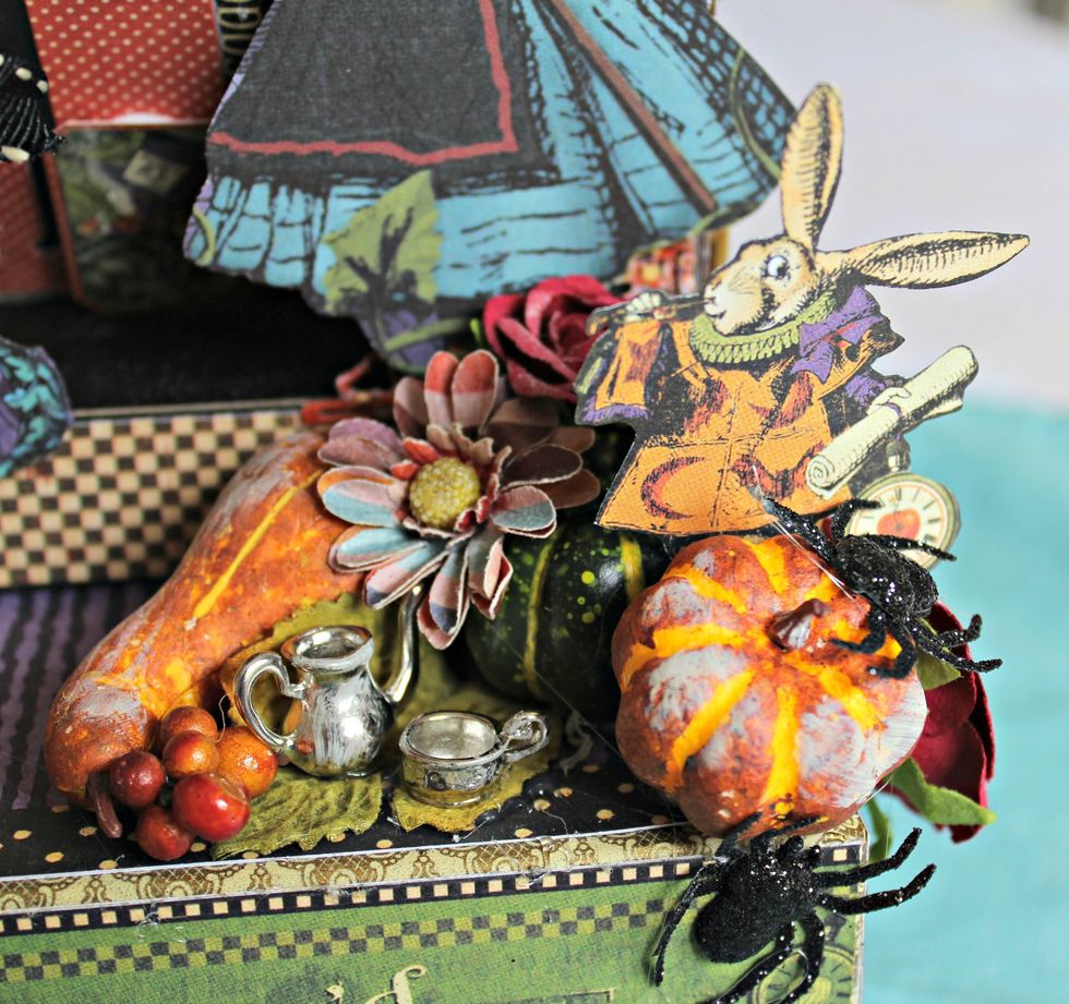 Remove pumpkins, leaves and berries from floral picks. Adhere to top of box along with small pitcher and cup. Fussy cut rabbit image from pattern paper and add to front of box.