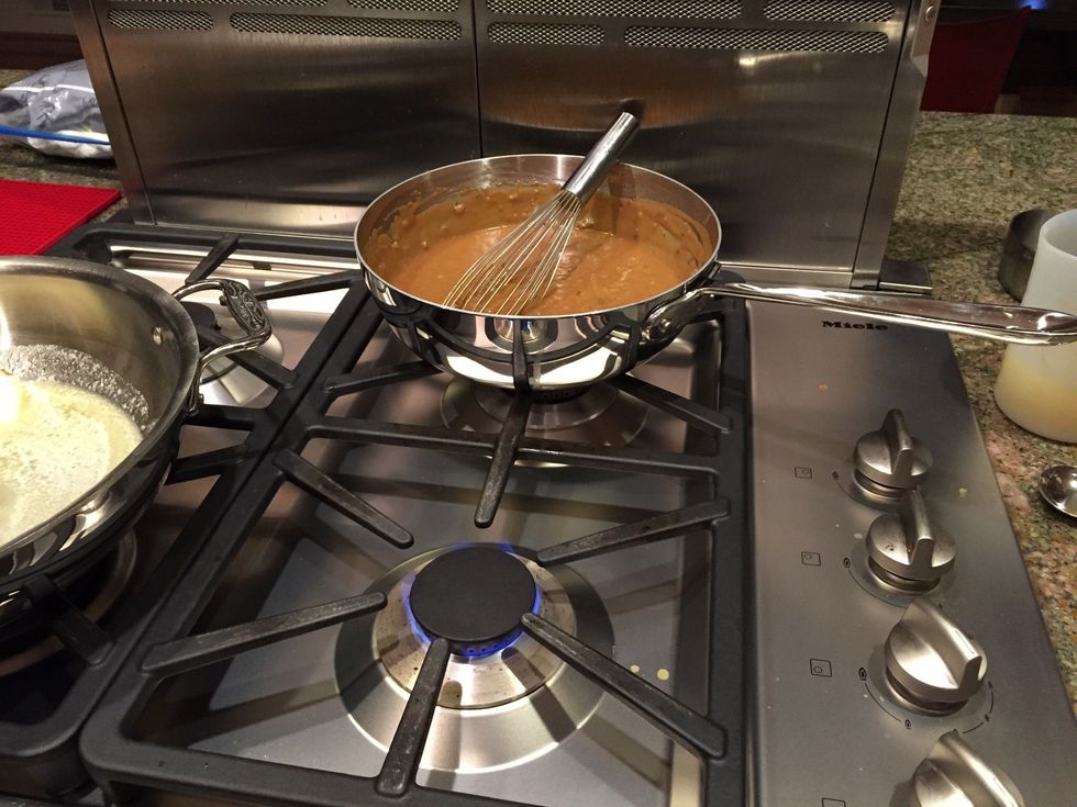 Remove roux and chicken broth/stock mixture from heat and move to crawfish/butter pan