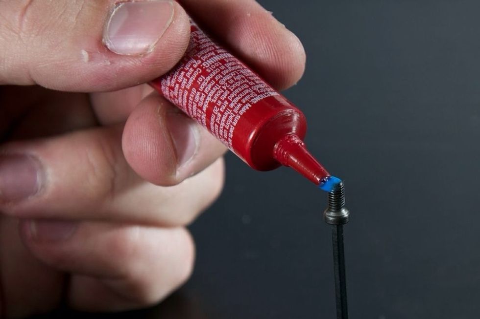 Remove screws one at a time and apply Locktite.