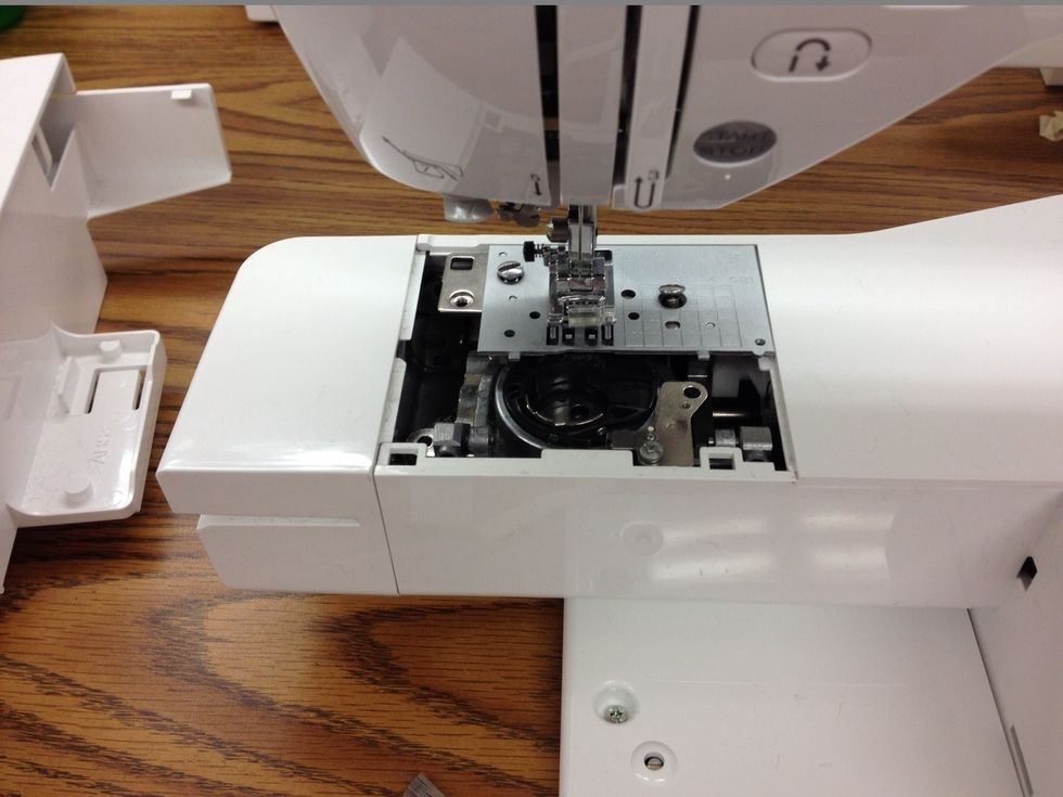 Remove slide plate, bobbin holder, and unscrew back plate.