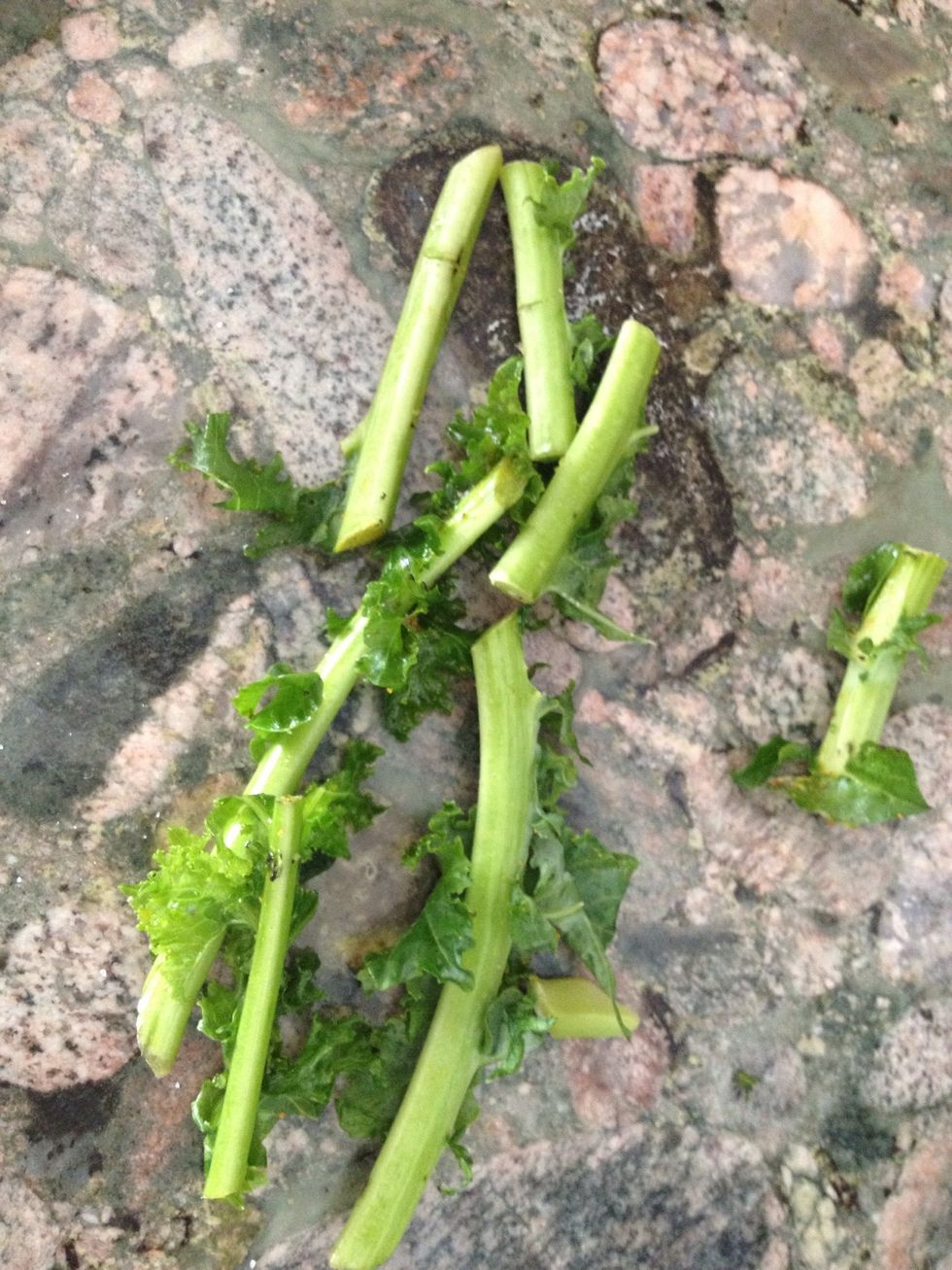 Remove stems by holding the tip of the stem with one hand and sliding your index & thumb along the stem to the tip.  If you buy bagged organic you will have less unstemming to do.