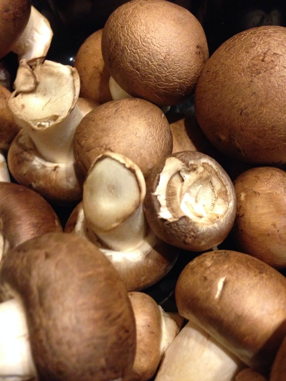 Remove stems from mushrooms and slice.
