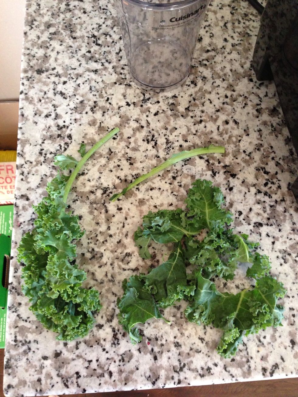 Remove stems from the kale, rinse and add to blender