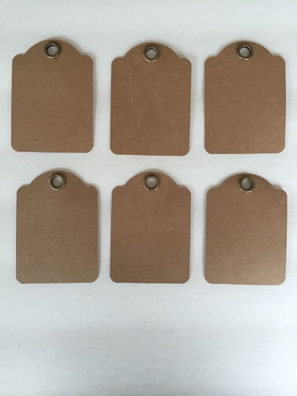 Remove tags from packaging. Ink and distress edges. Then apply Copper Stickles around edges.