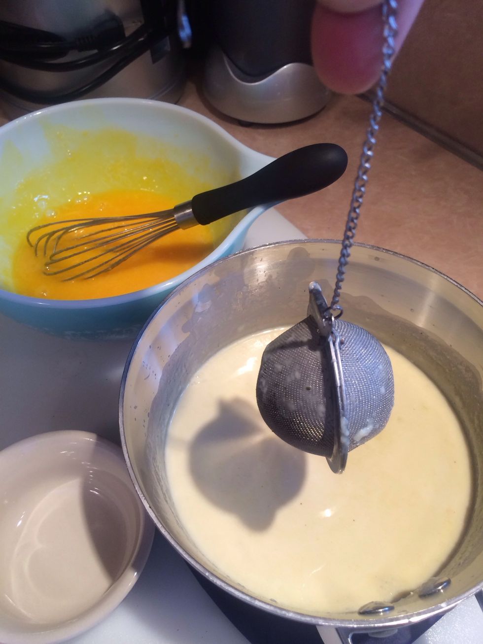 Remove tea ball, let it drain thoroughly. We want to collect as much of that beautiful delicate jasmine flavor as we can. Stir in vanilla.