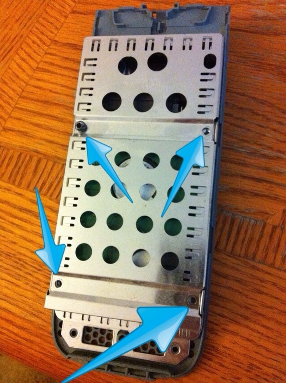 Remove the 4 screws in the holy metal case. If you don't have the right star screwdriver you can use small vice grips or needle nose pliers.(in the picture I only have one screw in for show)