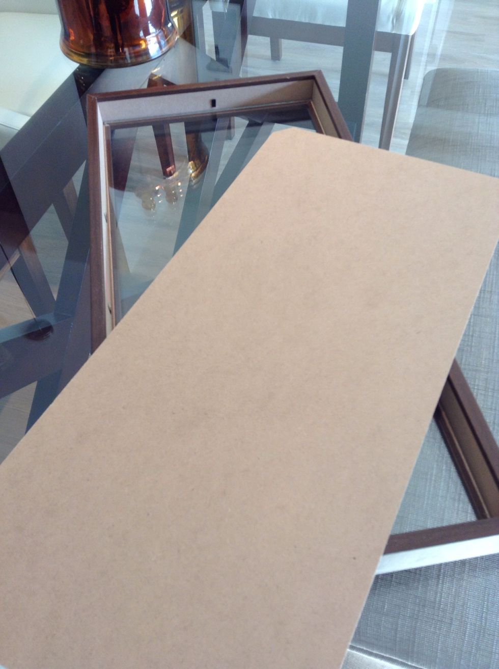 Remove the back panel of your frame.