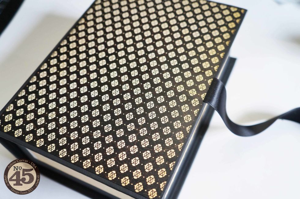 Remove the backing from the ScorTape and adhere your design paper to the box as shown.