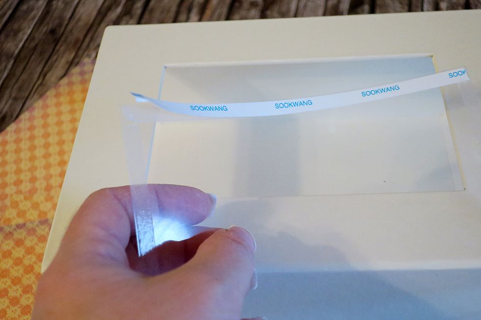 Remove the backing off the scor-tape on the acrylic sheet