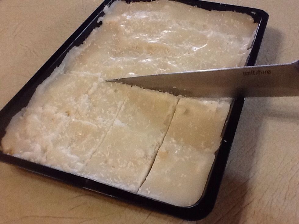 Remove the baking pan from the fridge and cut into pieces.
