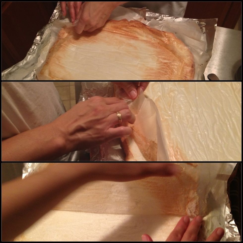 Remove the baking tray and slowly remove the wax paper. You can now see the opposite side of the baked meringue.