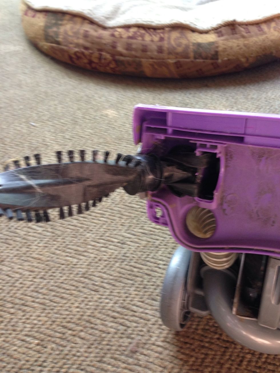 Remove the bar by grabbing the right side and lifting to the left until the bar pops out of the belt. It won't break. I'm assuming the belt is not already broken.